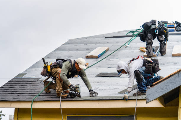 Professional Roofing technician working in Oakland Mills, PA